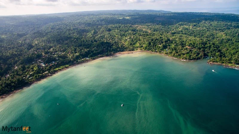 Aerial view of Drake Bay framed by forest and ocean